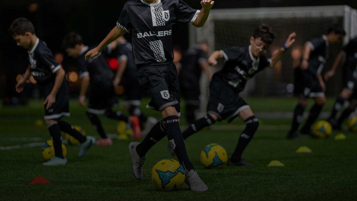 Squad working through a training drill in Ballers kit
